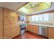 Updated kitchen features wood floors, stainless appliances, and a large window at 1417 E Marshall Ave, Phoenix, AZ 85014