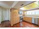 Well-lit kitchen featuring wood floors, stainless appliances, and lots of storage at 1417 E Marshall Ave, Phoenix, AZ 85014