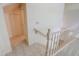 Second floor landing with tile flooring and wood railing at 1417 E Marshall Ave, Phoenix, AZ 85014