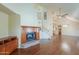 Open living room boasts hardwood floors, fireplace, and lots of natural light at 1417 E Marshall Ave, Phoenix, AZ 85014