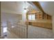 A spacious loft area with built-in shelves and cabinets, perfect for a home office or study at 1417 E Marshall Ave, Phoenix, AZ 85014