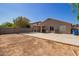 Spacious backyard area with a covered patio at 1619 E Aspen Ave, Buckeye, AZ 85326