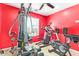 This room has an array of machines, tiled floors and a ceiling fan at 1619 E Aspen Ave, Buckeye, AZ 85326