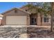 Charming single-story home with an attached two-car garage at 1619 E Aspen Ave, Buckeye, AZ 85326