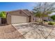 Charming single-story home with an attached two-car garage at 1619 E Aspen Ave, Buckeye, AZ 85326