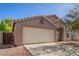 Charming single-story home with an attached two-car garage at 1619 E Aspen Ave, Buckeye, AZ 85326
