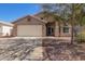 Charming single-story home featuring a two-car garage and low-maintenance landscaping at 1619 E Aspen Ave, Buckeye, AZ 85326