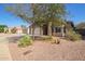 Well-maintained home with desert landscaping in the front yard at 1619 E Aspen Ave, Buckeye, AZ 85326