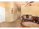 Inviting living area with neutral paint and tile flooring that seamlessly connects to other areas at 1619 E Aspen Ave, Buckeye, AZ 85326