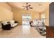 Bright living space with tile floors and access to the backyard, designed for comfortable living at 1619 E Aspen Ave, Buckeye, AZ 85326