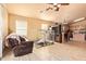 Open-concept living area featuring tile flooring and easy access to the kitchen and dining spaces at 1619 E Aspen Ave, Buckeye, AZ 85326