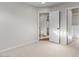 Light-filled bedroom with neutral carpet flooring and open doorways to other rooms at 1736 E Bluefield Ave, Phoenix, AZ 85022