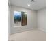 Cozy bedroom with neutral carpet, a window viewing brick and lush landscaping at 1736 E Bluefield Ave, Phoenix, AZ 85022