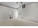 Spacious main bedroom featuring vaulted ceilings, neutral carpet, and a bright window at 1736 E Bluefield Ave, Phoenix, AZ 85022