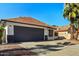 This inviting home features a well-manicured front yard and an attached two-car garage at 1736 E Bluefield Ave, Phoenix, AZ 85022