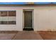 Inviting front entrance with a gray door, window, and tasteful landscaping at 1736 E Bluefield Ave, Phoenix, AZ 85022