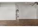 Spacious living room features vaulted ceilings, hard wood flooring, and an arched entryway at 1736 E Bluefield Ave, Phoenix, AZ 85022