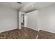Spacious living area with wood flooring and an open doorway, perfect for entertaining at 1736 E Bluefield Ave, Phoenix, AZ 85022