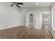 Light-filled primary bedroom features hardwood flooring, and a view to the attached sitting room at 1736 E Bluefield Ave, Phoenix, AZ 85022