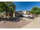 Beautiful single-Gathering home featuring desert landscaping, and an attached two-car garage at 17611 W Watson Ln, Surprise, AZ 85388