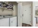 Laundry room with modern washer and dryer, providing convenience and efficiency in a dedicated space at 17611 W Watson Ln, Surprise, AZ 85388