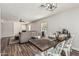 Cozy living area with a view of the dining table and comfortable seating arrangements at 17611 W Watson Ln, Surprise, AZ 85388
