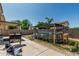 Backyard featuring an above ground pool, outdoor grill, desert landscaping, and seating, perfect for leisure at 17611 W Watson Ln, Surprise, AZ 85388