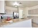 Kitchen features granite countertops, stainless appliances, ample storage and eat in counter seating at 18371 W Capistrano Ave, Goodyear, AZ 85338