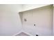 Bright, empty laundry room with connections for a washer and dryer at 18371 W Capistrano Ave, Goodyear, AZ 85338