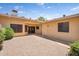Private backyard patio offers easy access to the home's entrance and outdoor spaces at 18416 N Spanish Garden Dr, Sun City West, AZ 85375