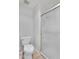 Modern bathroom featuring a toilet and glass-enclosed shower, with clean, minimalist design at 18416 N Spanish Garden Dr, Sun City West, AZ 85375