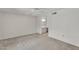 Spacious bedroom with neutral colors, a ceiling fan, and an adjoining bathroom at 18416 N Spanish Garden Dr, Sun City West, AZ 85375