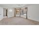 Spacious bedroom with neutral carpet, lots of natural light, and adjoining bathroom at 18416 N Spanish Garden Dr, Sun City West, AZ 85375