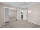 Inviting bedroom boasts mirrored closet doors and a private bathroom at 18416 N Spanish Garden Dr, Sun City West, AZ 85375