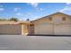 Two-car garage with adjacent entry gate, offering convenience and privacy at 18416 N Spanish Garden Dr, Sun City West, AZ 85375