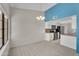Inviting living area featuring a view of the kitchen with granite counters at 18416 N Spanish Garden Dr, Sun City West, AZ 85375