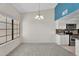 Open floor plan with dining area and kitchen view at 18416 N Spanish Garden Dr, Sun City West, AZ 85375