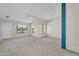Bright living room with large windows offering a lot of natural light at 18416 N Spanish Garden Dr, Sun City West, AZ 85375