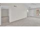 Spacious, light-filled living area with neutral carpet at 18416 N Spanish Garden Dr, Sun City West, AZ 85375
