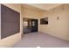 Covered patio offers shade, access to backyard, and comfortable outdoor living at 18416 N Spanish Garden Dr, Sun City West, AZ 85375