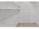 Walk-in closet providing ample shelving and storage space, perfect for organization at 18416 N Spanish Garden Dr, Sun City West, AZ 85375