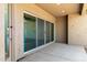 Covered back patio featuring sliding glass door entry to the home at 18908 W Montebello Ave, Litchfield Park, AZ 85340