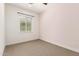 Bedroom featuring light walls, carpet, and window at 18908 W Montebello Ave, Litchfield Park, AZ 85340