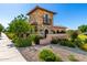 Community entrance featuring beautiful stone tower, manicured landscaping, and welcoming signage at 18908 W Montebello Ave, Litchfield Park, AZ 85340