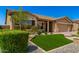 Attractive single-Gathering home with stone accents, a well-maintained lawn, and a two-car garage at 18908 W Montebello Ave, Litchfield Park, AZ 85340