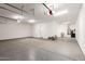 Spacious garage with epoxy floors and access door to the house at 18908 W Montebello Ave, Litchfield Park, AZ 85340