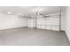Spacious garage with epoxy floors and two garage doors at 18908 W Montebello Ave, Litchfield Park, AZ 85340