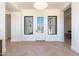 Bright and airy foyer with herringbone hardwood flooring and modern lighting at 2095 N 77Th Pl, Mesa, AZ 85207