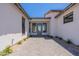 Inviting front entrance with a paved walkway, modern doors, and manicured landscaping at 2095 N 77Th Pl, Mesa, AZ 85207