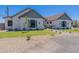 Beautiful home featuring a well-manicured lawn and thoughtful landscaping, enhancing its curb appeal at 2095 N 77Th Pl, Mesa, AZ 85207